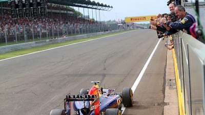 Daniel Ricciardo of Australia and Infiniti Red Bull Racing drives past members of his team on the pit straight as they applaud him during the Hungarian Formula One Grand Prix at Hungaroring on July 27, 2014 in Budapest, Hungary. Mark Thompson/Getty Images