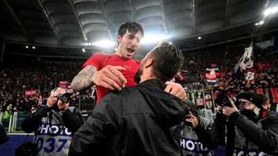 AC Milan's Sandro Tonali and Olivier Giroud celebrate after the match. Reuters
