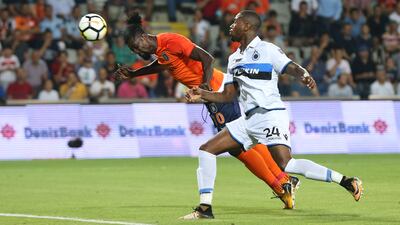 Basaksehir Istanbul's Emmanuel Adebayor, left, scores a diving headers against Bruge during the Uefa Champions League third qualifying round second-leg match in Istanbul, Turkey, 02 August 2017. Tolga Bozoglu / EPA
