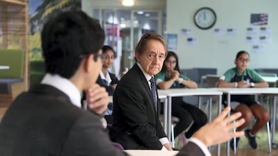 Sir Anthony Seldon, the educationalist and biographer of UK prime ministers, speaks with students during his visit to the GEMS Wellington International School in Dubai on Sunday. Pawan Singh / The National