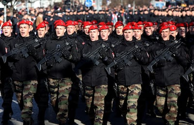 A Bosnian Serb unit of special police forces march through the center of Banja Luka during ceremony a marking the 28th anniversary of founding of Republika Srpska. AFP
