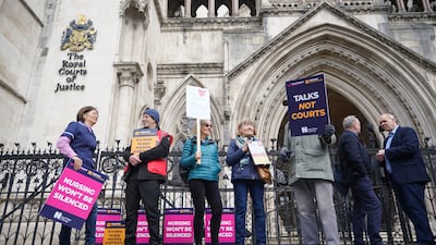 Nurses picket outside the London court where the government brought the challenge over their planned strike action. AP