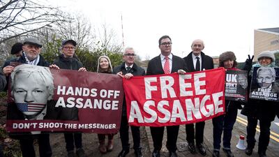 Australian MPs Andrew Wilkie, centre, and George Christensen, fourth right, with John Shipton, third right, the father of WikiLeaks founder Julian Assange, outside Belmarsh prison.