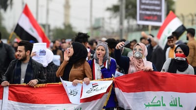 Iraqi university students carry the Iraqi national flag during a strike and protests in central Baghdad, Iraq. EPA
