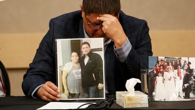 Mark Arcand, brother of James Smith Cree Nation stabbing victim Bonnie Burns, cries as he holds her picture at a news conference in Saskatoon, Saskatchewan. AFP