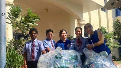 Pupils collect plastic bottles for recyling. Photo: Pristine Private School