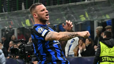 Inter Milan's Austrian forward Marko Arnautovic celebrates after scoring the winner against Atletico Madrid at San Siro. AFP