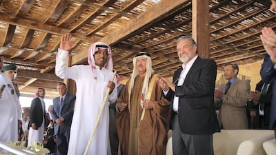 The winner is awarded a sword by Sheikh Sultan bin Hamdan bin Zayed Al Nahyan, President of the Arab Camel Racing Federation and with the presence of Prince Asem bin Nayef, vice president of the Jordan Royal Equestrian Federation, for winning a run during the annual camel race in Wadi Rum, Jordan. Salah Malkawi / The National