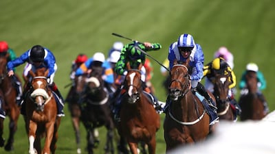Paul Hanagan riding Taghrooda, right, wins the English Oaks at Epsom Racecourse on June 06, 2014, in Epsom, England. Charlie Crowhurst / Getty Images