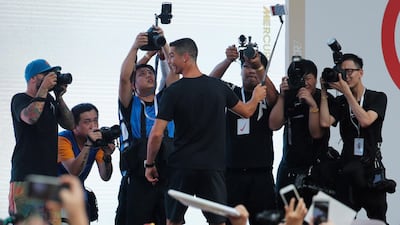 Ronaldo takes a selfie photo with fans. EPA