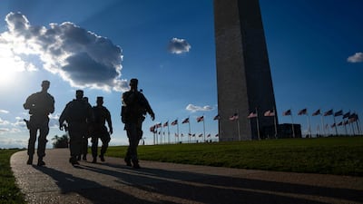 Members of the National Guard patrol near the Washington Monument on August 8. Getty Images via AFP