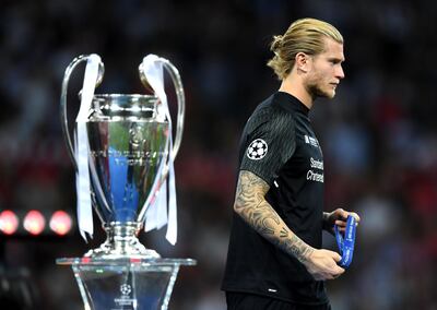 Loris Karius walks past the Uefa Champions League trophy. Shaun Botterill / Getty Images