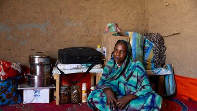 Twenty-six-year-old Sudanese refugee Hamra Adam Mohammed inside the shelter she built in the Farchana refugee camp