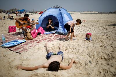 Israelis enjoy a day at the beach during parliamentary election day southern Israel. Reuters