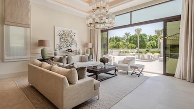 A family room looking out to the garden. Courtesy Luxhabitat Sotheby's International Realty