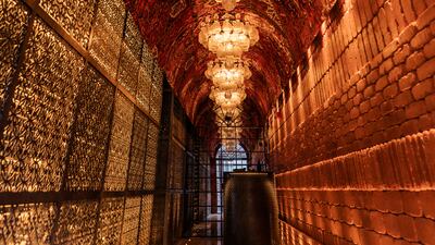 Elaborate chandeliers dot the ceiling at Sucre. The interior is done up in warm shades.