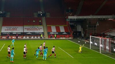 Roberto Firmino's defelcted effort heads towards the Sheffield United net to make it 2-0. PA