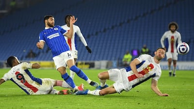 Alireza Jahanbakhsh of Brighton in action against Gary Cahill and Jordan Ayew of Crystal Palace. EPA