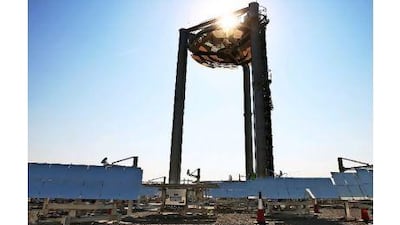 Readers argue that renewables like this solar tower at Masdar City are critical to the future. Amy Leang / The National