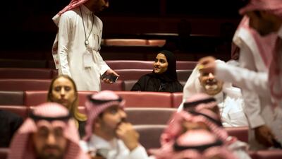 Vsitors wait for the movie to begin during an invitation-only screening, at the King Abdullah Financial District Theater, in Riyadh, Saudi Arabia. Amr Nabil / AP