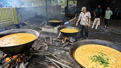 Men prepare curry dishes for celebrations in Banda Aceh, Indonesia. AFP