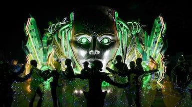 Dancers perform in front of a float as they take part in the Festival of Light in San Jose. AFP