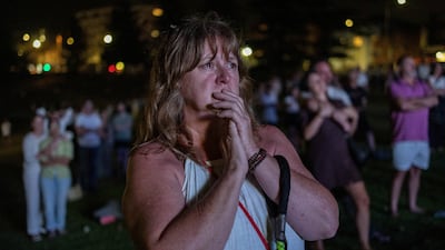 A woman cries during the vigil for victims and survivors on Bondi Beach. Reuters