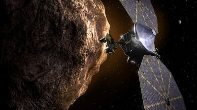 An artist impression of Nasa's Lucy spacecraft flying by a Trojan asteroid. Photo: Nasa