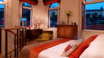 Now that your dollars will stretch further, upgrade to a suite like this one at The Augustine in Prague, Czech Republic. Photo: Starwood Hotels & Resorts