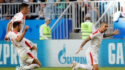 Serbia's Aleksandar Kolarov, right, celebrates his winning goal against Costa Rica, which has also earned him a free Lada. AP