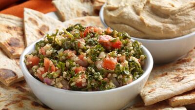 Bowls of tabouli and hummus served as an appetizer with cut pita bread (iStockphoto.com)