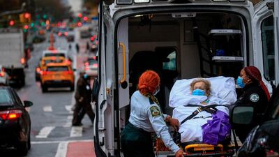 A patient is transported outside of Tisch Hospital in New York, US. AFP