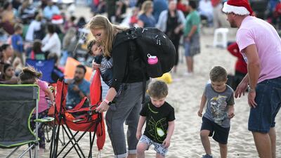 Abu Dhabi, United Arab Emirates - Family set up their spots before the carol singing in the desert. Khushnum Bhandari for The National