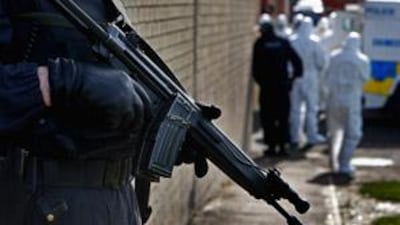 File Photo: Police officers continue follow up searches near the area where gunmen shot a police officer last week, two days after the killings of two British soldiers
