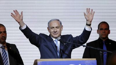 Israeli prime minister Benjamin Netanyahu waves to supporters after hearing exit polls in the Israeli election at Likud party headquarters in Tel Aviv, Israel taken on March 18, 2015. Mr Netanyahu managed to form a new coalition government on Wednesday before a deadline expired. Amir Cohen/Reuters