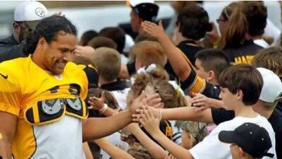 Troy Polamalu, left, has been taking the time to interact with Pittsburgh's younger fans, and also has been acting as more of a coach to the Steelers' young players.