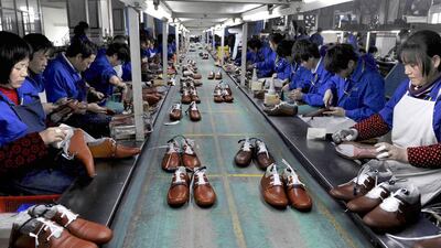 Employees work at a shoe factory in Lishui, Zhejiang province. The World Trade Organisation expects China’s share of world trade to rise to 20 per cent or more. Lang Lang / Reuters