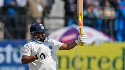 Sarfaraz Khan celebrates reaching his fifty against England in Dharamsala. AP