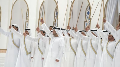 A traditional dance is performed during a mass wedding reception for Sheikh Mohammed bin Saud Al Qasimi, Crown Prince of Ras Al Khaimah at the Al Bayt Mitwahid wedding hall. Mohammed Al Hammadi / Crown Prince Court - Abu Dhabi
