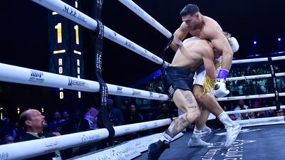 Jake Paul, left, and Tommy Fury, in action. AP Photo