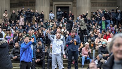 Crowds not wearing face masks gather at St George's Hall during an anti lockdown protest on November 14 in Liverpool. Getty Images
