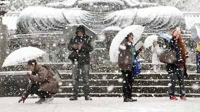 The Great Buddha statue is covered with snow at Kotoku-in temple in Kamakura, near Tokyo. Kazuhiro Ibuki / Kyodo News via AP