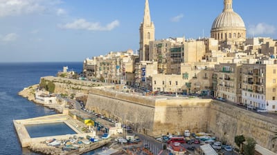 The Valletta skyline with the dome of the Carmelite Church and St. Pauls Anglican Cathedral. Neale Clark / Robert Harding World Imagery / Corbis