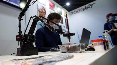 A demonstration of AI Norn, a painting robot created by Russian data scientists Anna Mischenko and Nikolay Gavrilin. Leslie Pableo / The National