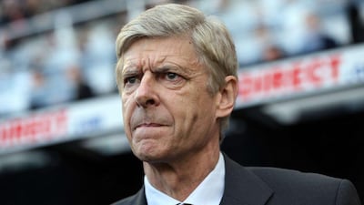 Arsenal manager Arsene Wenger is deadly serious when it comes to his own expectation levels for the team next year. AFP PHOTO / IAN MACNICOL