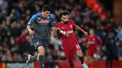 Mohamed Salah is challenged by Kim Min-Jae of Napoli. Getty