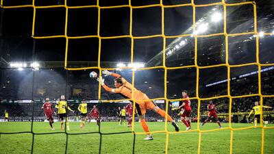 Bayern goalkeeper Manuel Neuer concedes to Dortmund's Erling Haaland. EPA