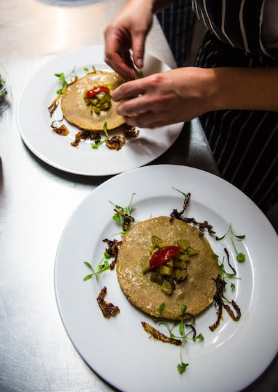 Kubbat Mosul, a type of meat pie, made up of two layers of bulgur with a thin layer of minced meat mixture in the middle. Philip Juma