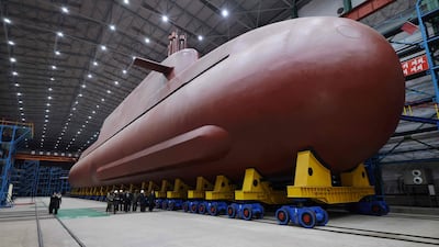 North Korean leader Kim Jong-un visits the fabrication shed of an 8,700-tonne nuclear-powered guided missile submarine somewhere in North Korea. AFP