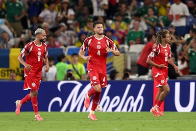 Omar Rekik, centre, scored his first international goal to pull Tunisia back into the match. AFP